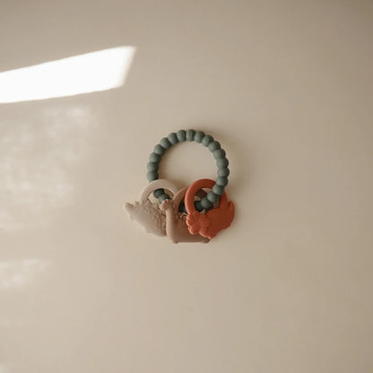 Mushie - Baby Beißring Silikon Dino