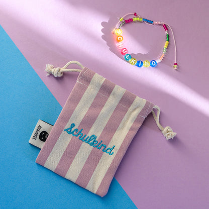 Ava &amp; Yves -Perlenarmband Schulkind in bunt mit Säckchen rosa