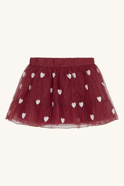 Tüllrock mit elastischem Bund. Der Rock hat aufgenähte Herzen und hübsche Glitzerdetails. Darunter befindet sich ein weicher Petticoat.